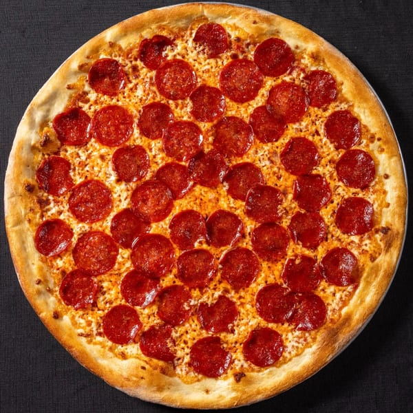 A whole pepperoni pizza from Vinnie's Pizzeria, with melted cheese and a golden crust.