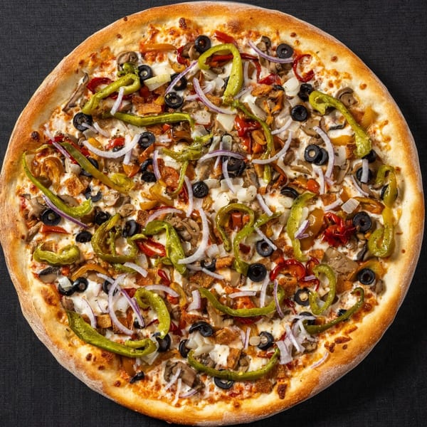 A Vinnie's Pizzeria pizza with green peppers, onions, black olives, and mushrooms.