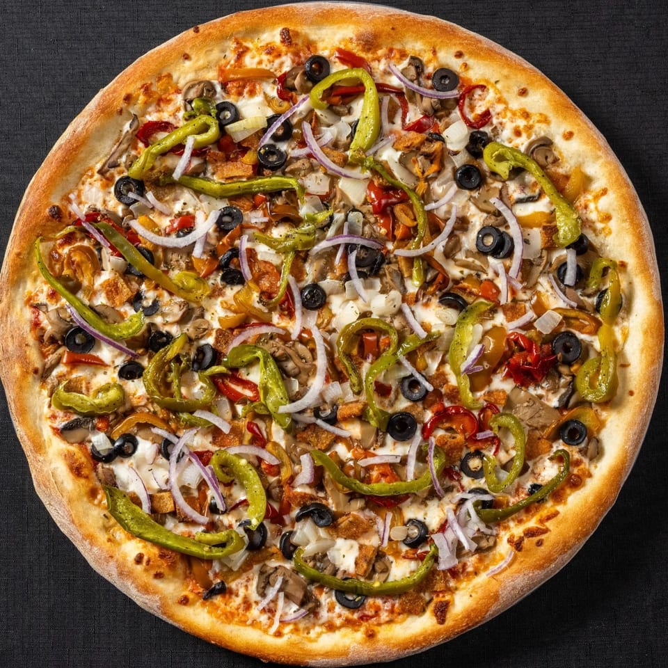 A Vinnie's Pizzeria pizza with green peppers, onions, black olives, and mushrooms.